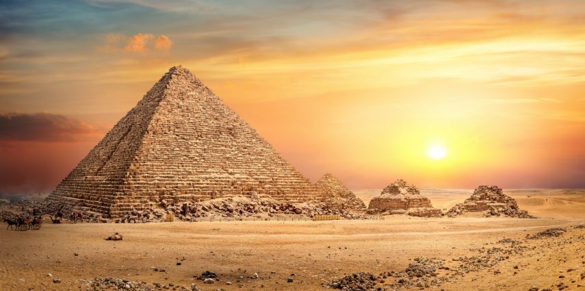 Egyptian pyramid in sand desert and clear sky